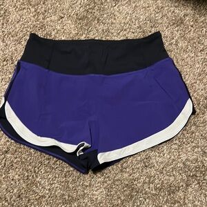Size small purple and black Athleta running shorts